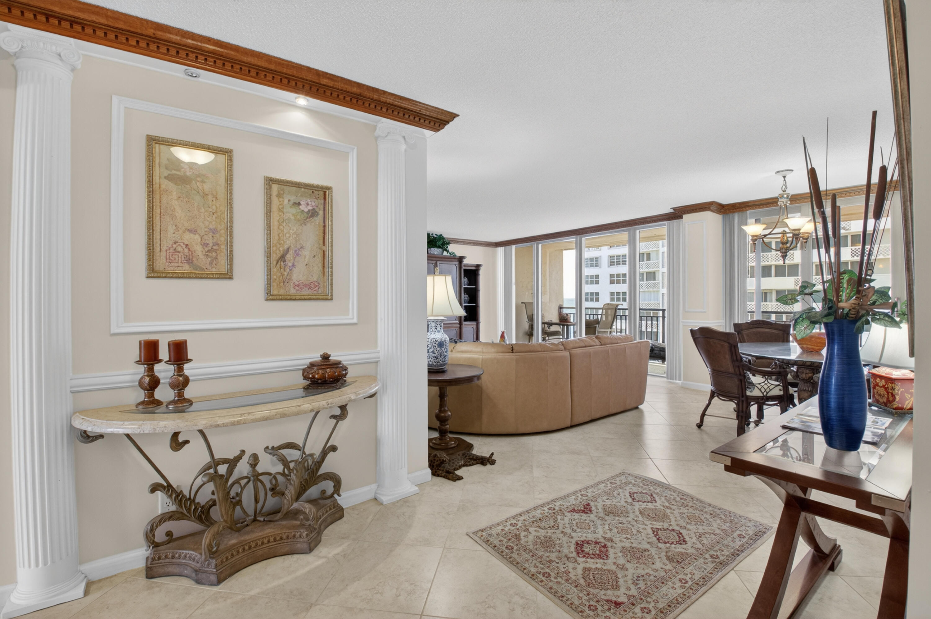 1180 South Ocean Boulevard, Unit 5C Boca Raton, FL 33432 - Photo 16 of 43 a living room with furniture and a table