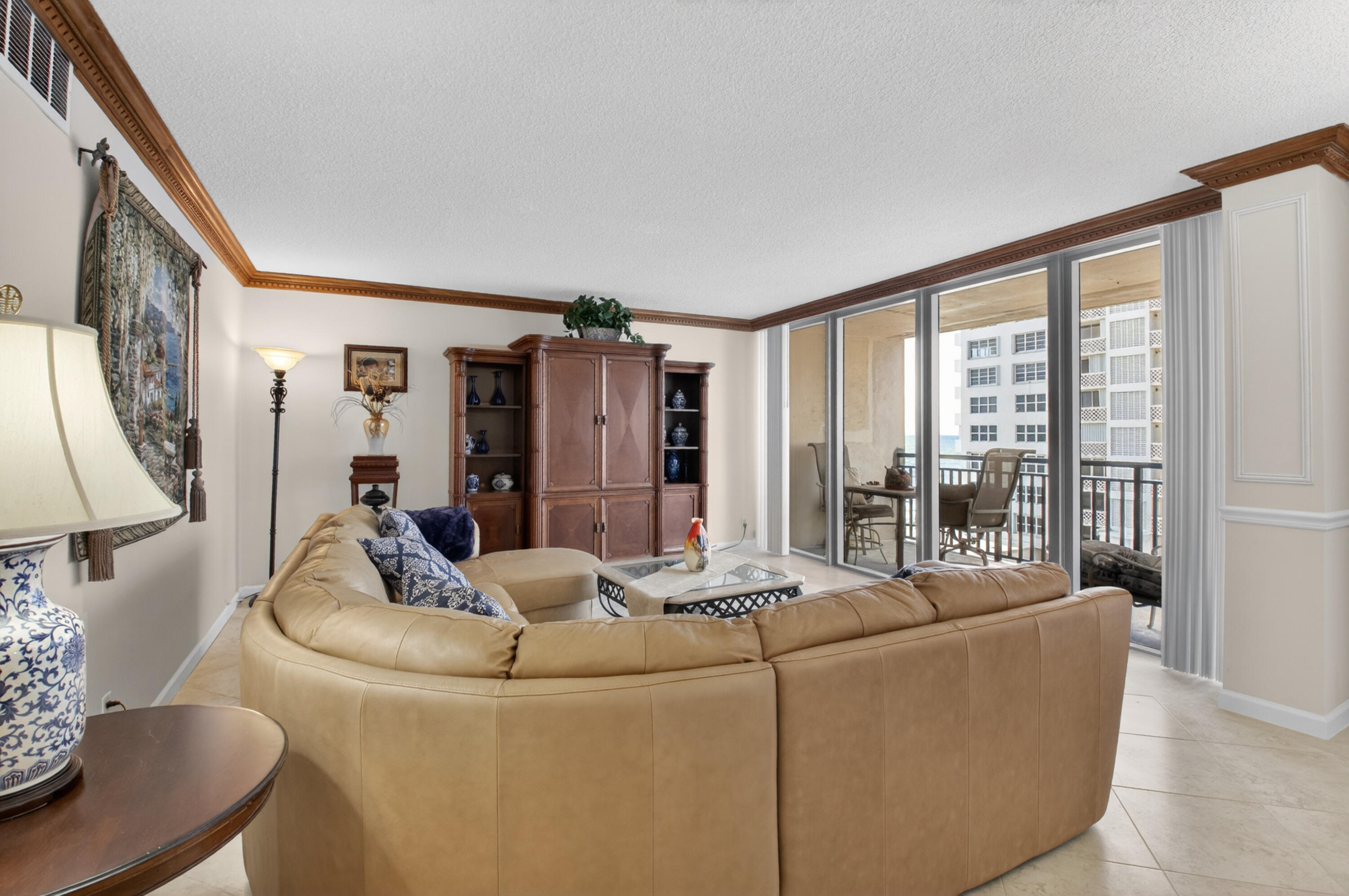 1180 South Ocean Boulevard, Unit 5C Boca Raton, FL 33432 - Photo 17 of 43 a living room with furniture and a large window