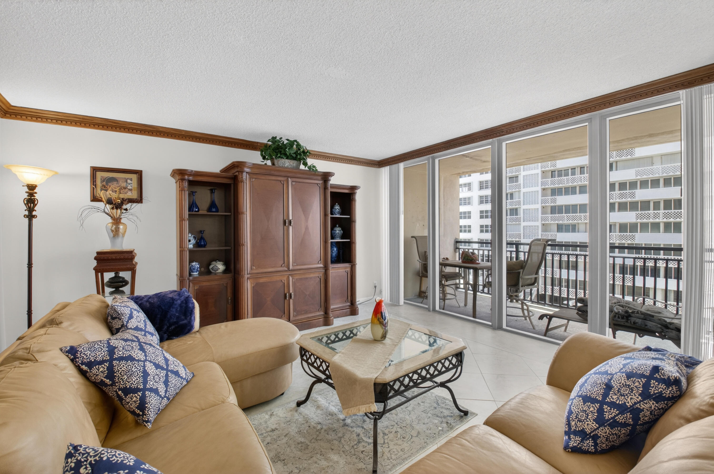 1180 South Ocean Boulevard, Unit 5C Boca Raton, FL 33432 - Photo 18 of 43 a living room with furniture and a large window