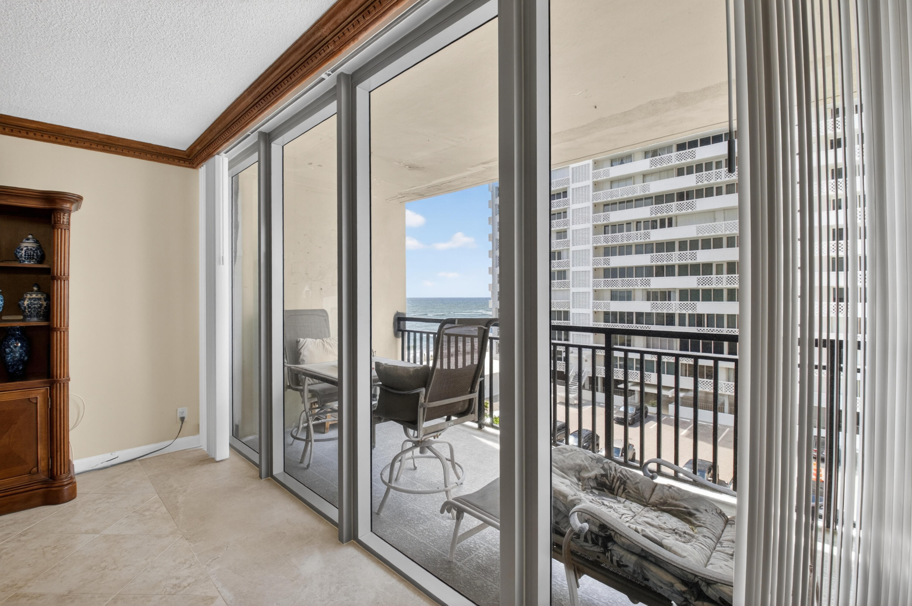 1180 South Ocean Boulevard, Unit 5C Boca Raton, FL 33432 - Photo 20 of 43 a view of a balcony and a floor to ceiling window