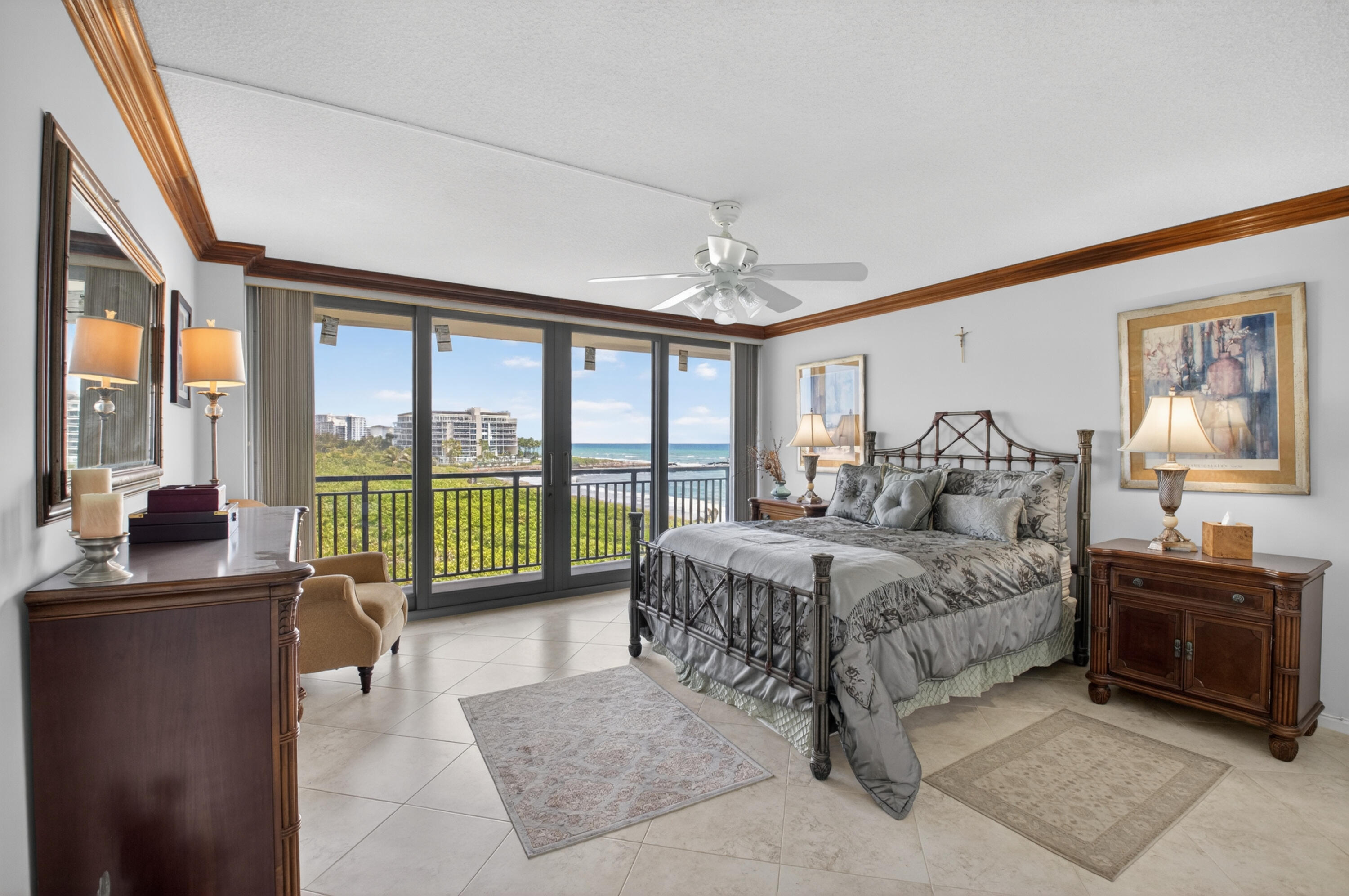 1180 South Ocean Boulevard, Unit 5C Boca Raton, FL 33432 - Photo 29 of 43 a bedroom with a large bed and a balcony view