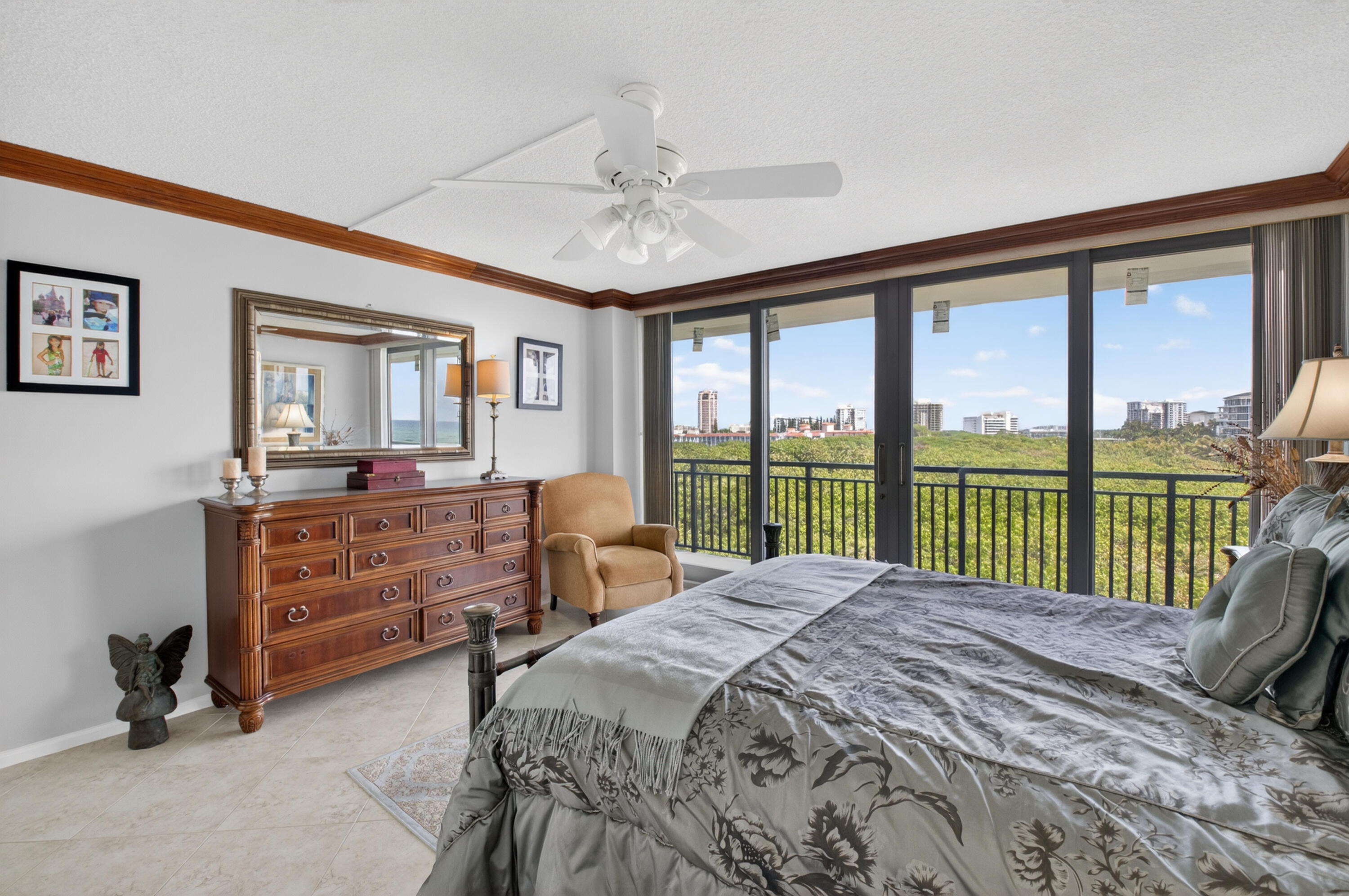 1180 South Ocean Boulevard, Unit 5C Boca Raton, FL 33432 - Photo 30 of 43 a bedroom with a bed and a large window