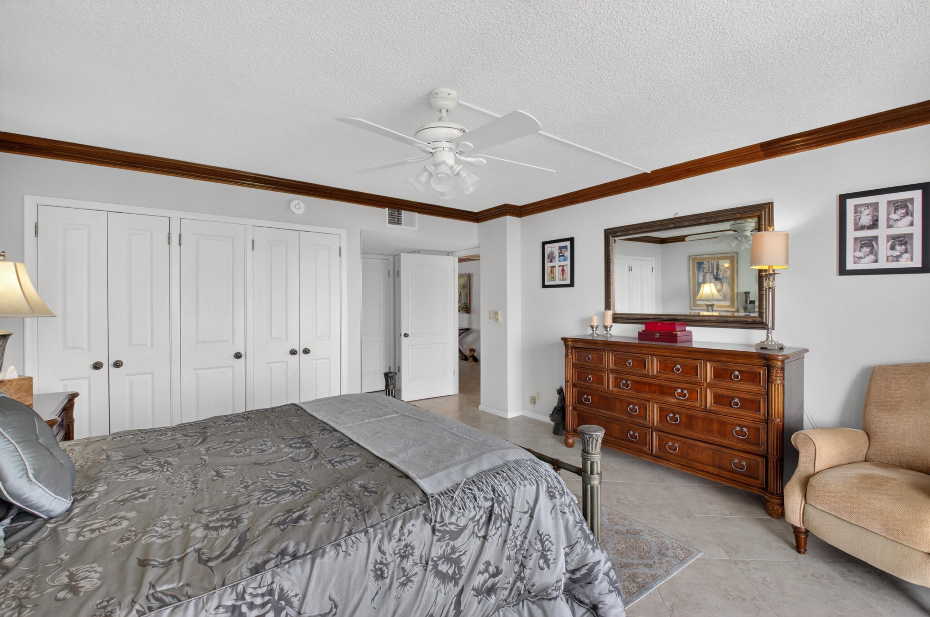 1180 South Ocean Boulevard, Unit 5C Boca Raton, FL 33432 - Photo 31 of 43 a bedroom with a bed and furniture