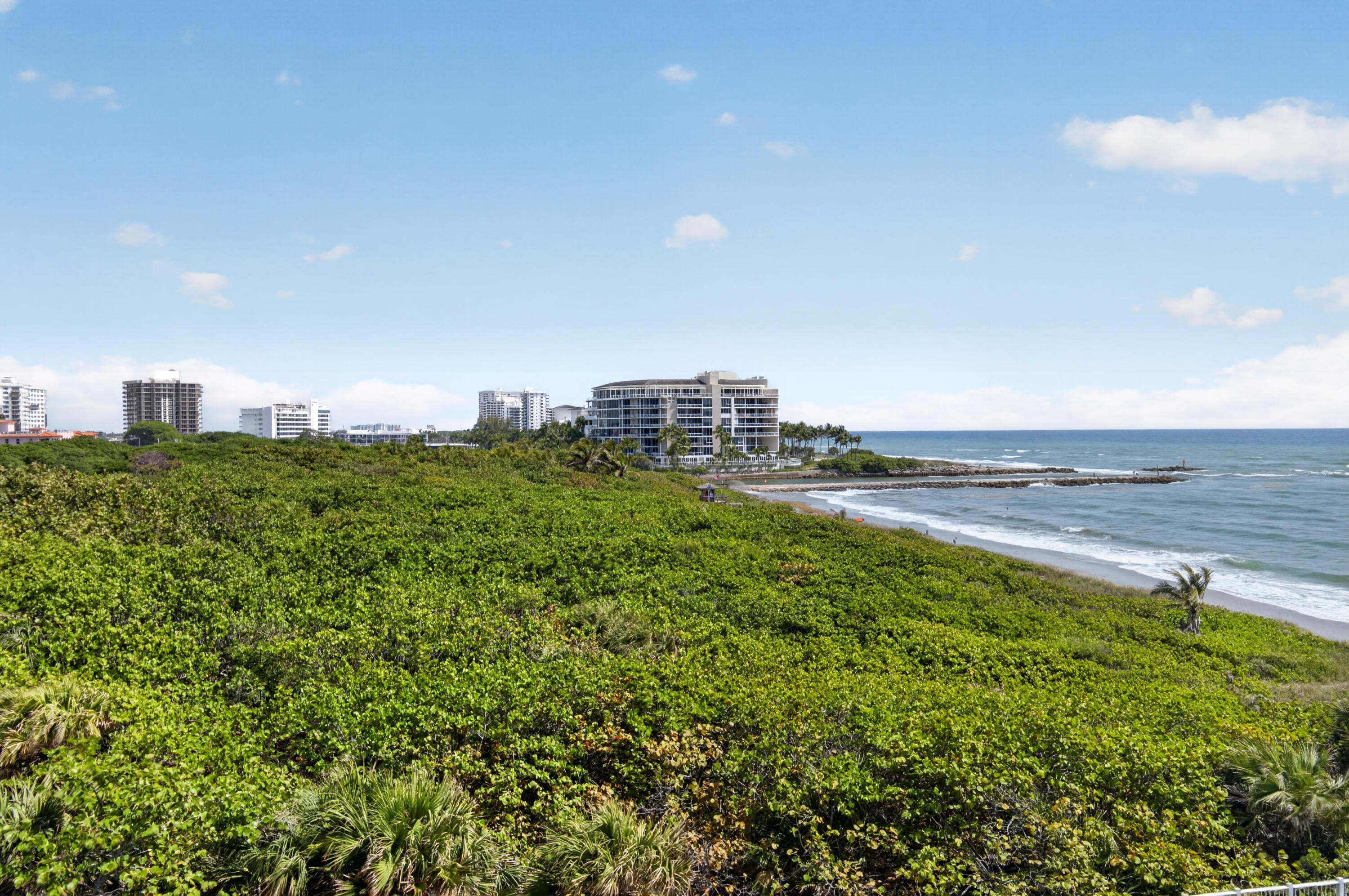 1180 South Ocean Boulevard, Unit 5C Boca Raton, FL 33432 - Photo 33 of 43 a view of a big yard with large buildings and wooden fence