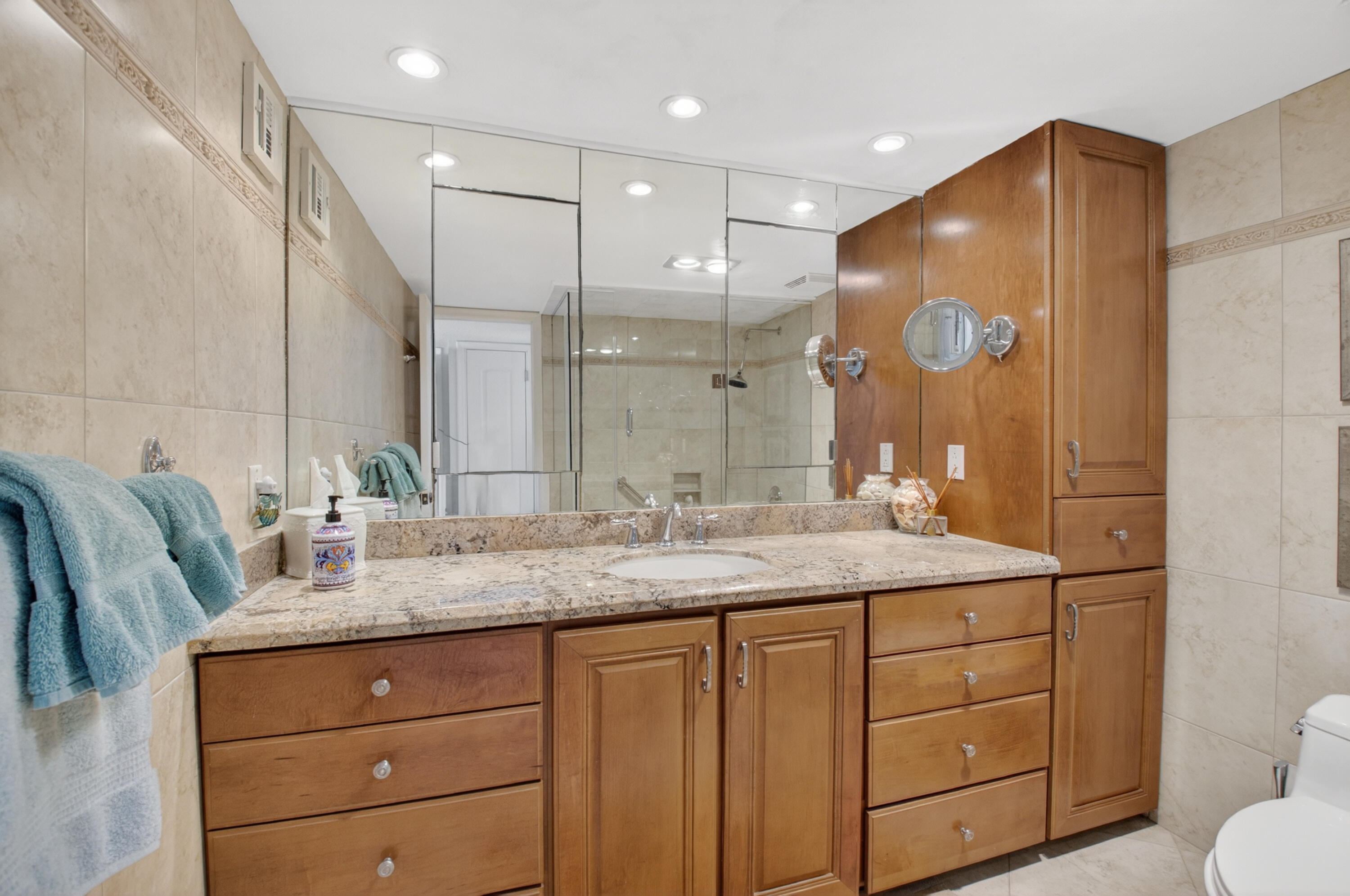 1180 South Ocean Boulevard, Unit 5C Boca Raton, FL 33432 - Photo 34 of 43 a bathroom with a granite countertop sink mirror and double