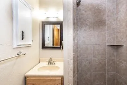 a spacious bathroom with a double vanity sink and a mirror