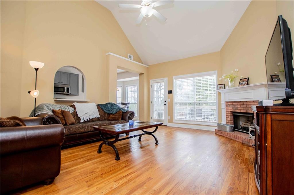 2657 Neighborhood Walk Villa Rica, GA 30180 - Photo 21 of 81 a living room with furniture and a fireplace
