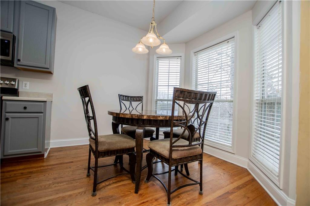 2657 Neighborhood Walk Villa Rica, GA 30180 - Photo 30 of 81 a view of a dining room with furniture and wooden floor