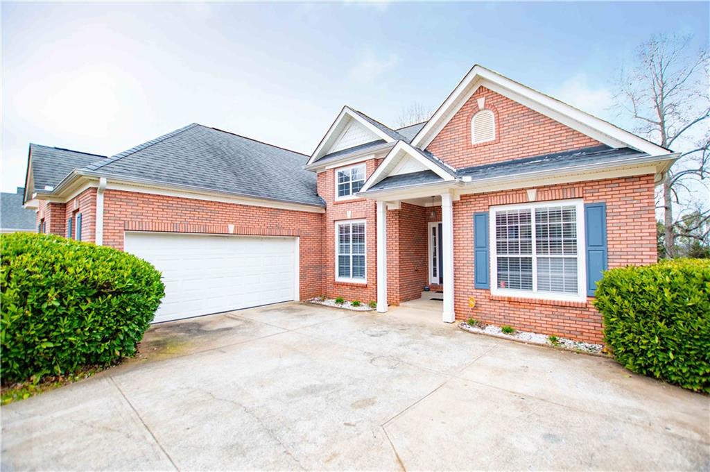 2657 Neighborhood Walk Villa Rica, GA 30180 - Photo 4 of 81 a front view of a house with a yard and garage