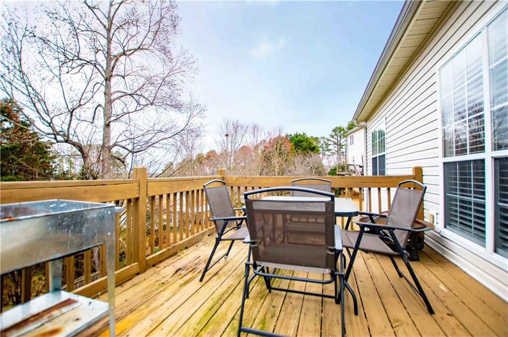 2657 Neighborhood Walk Villa Rica, GA 30180 - Photo 78 of 81 a view of balcony with wooden floor and outdoor seating