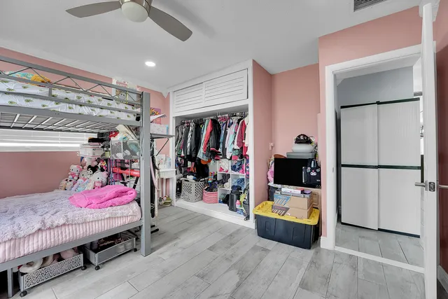 a bed room with a bed and a walk in closet