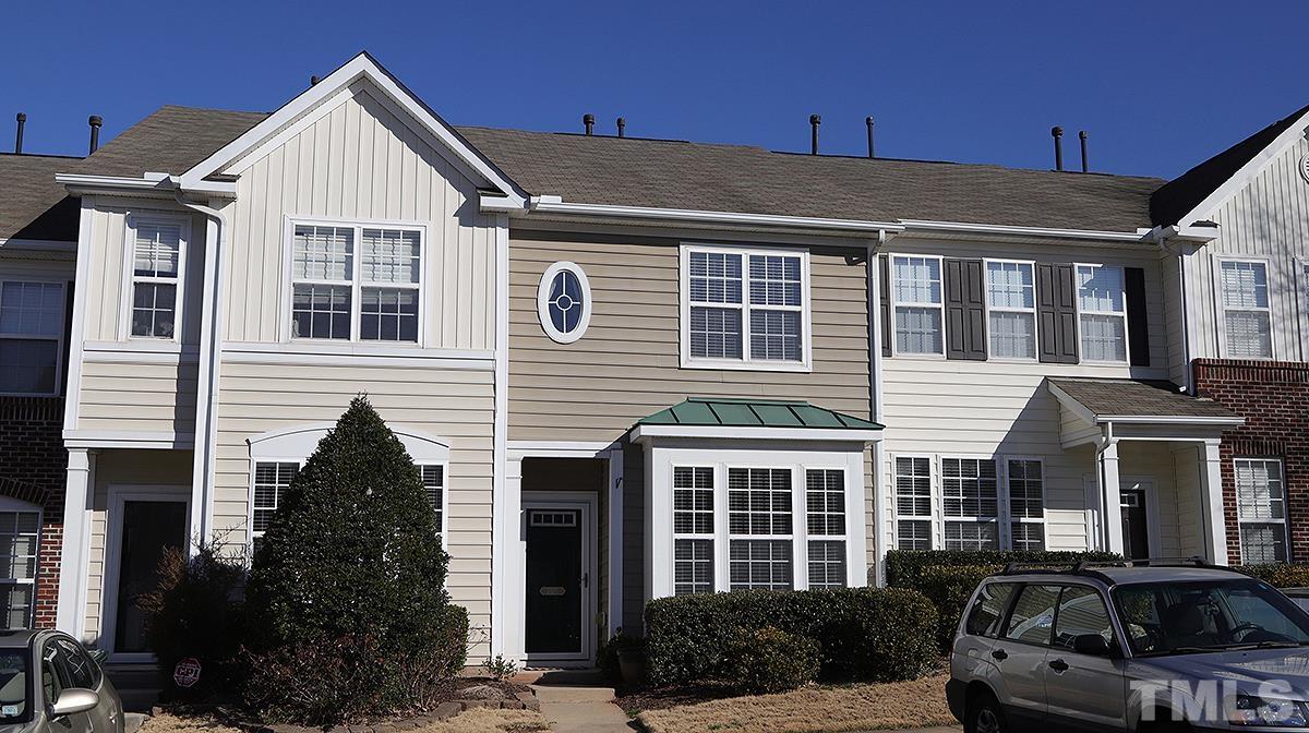7626 Winners Edge Street Raleigh, NC 27617 - Photo 1 of 20 a front view of a house with a yard