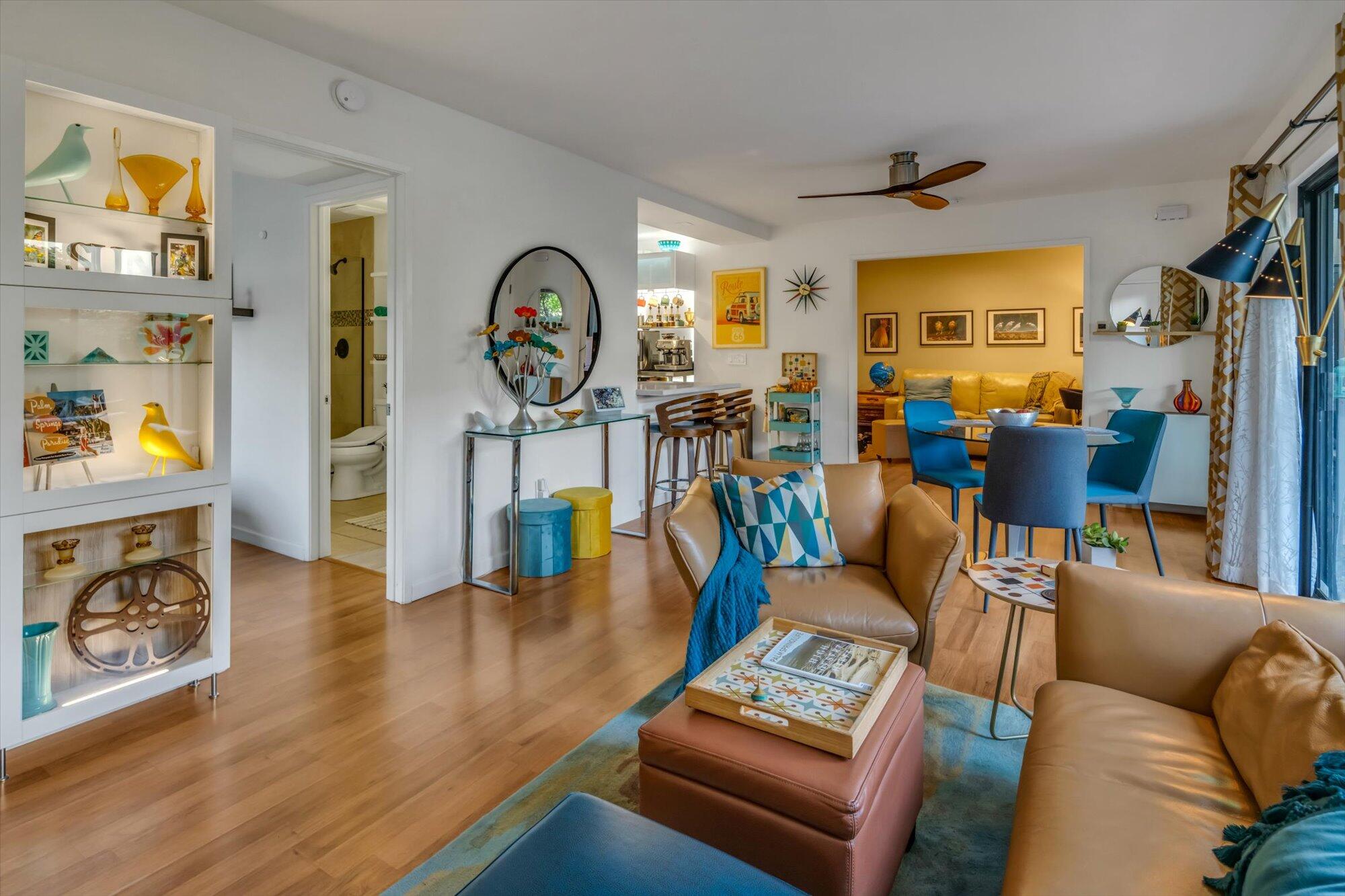 1100 East Amado Road, Unit 12B1 Palm Springs, CA 92262 - Photo 12 of 29 a living room with furniture and a wooden floor