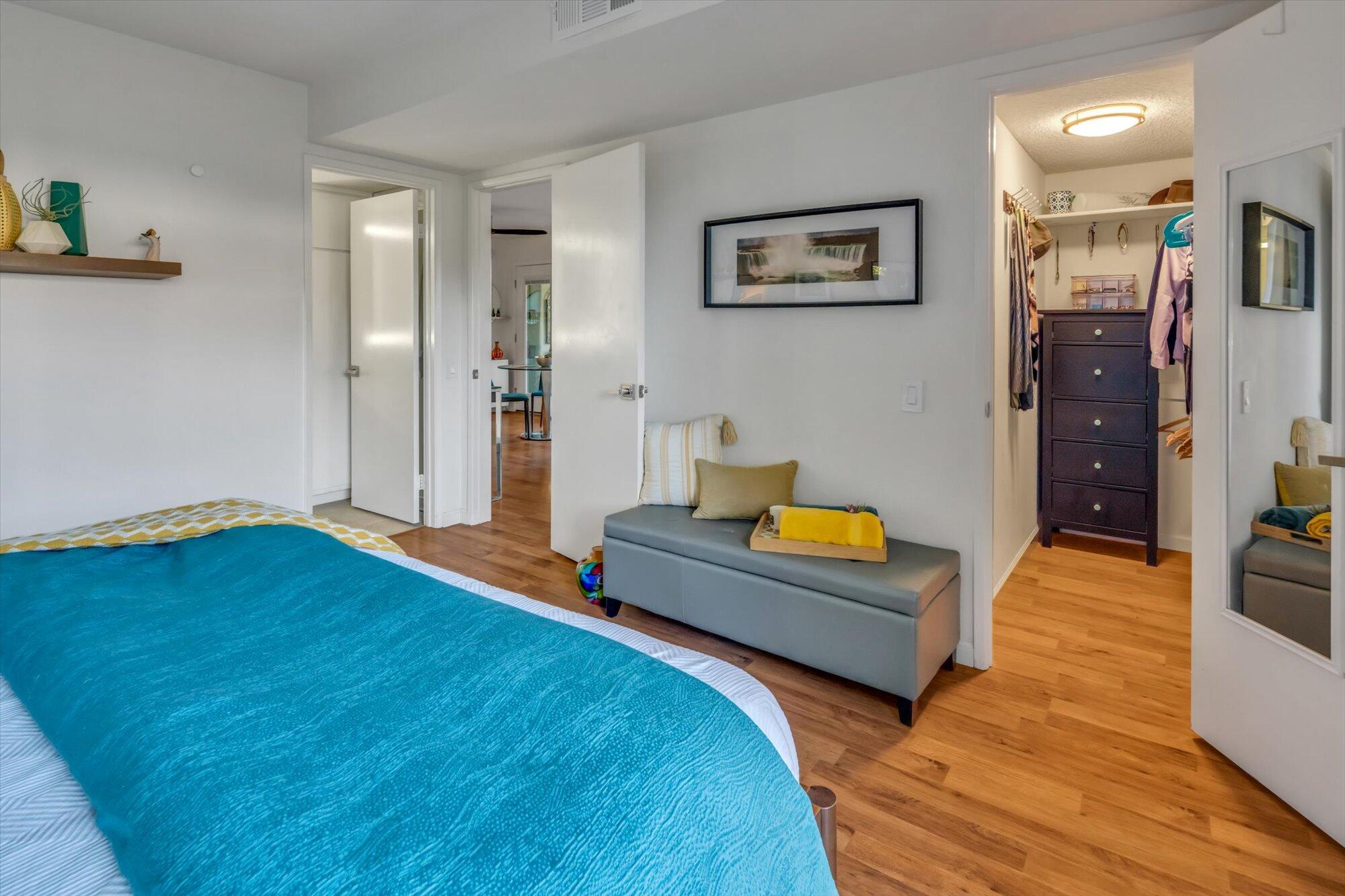 1100 East Amado Road, Unit 12B1 Palm Springs, CA 92262 - Photo 16 of 29 a bedroom with a bed and a view of living room