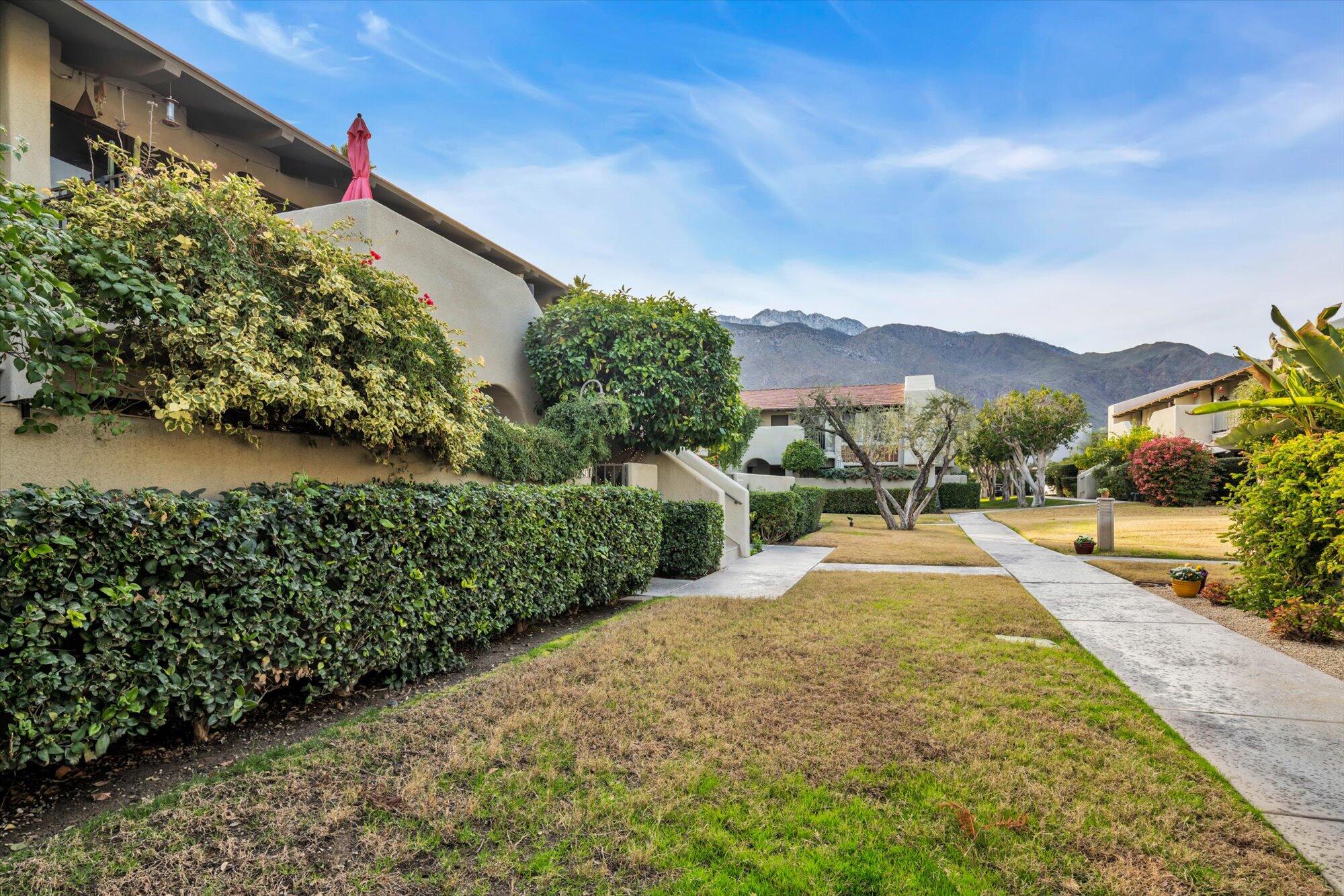 1100 East Amado Road, Unit 12B1 Palm Springs, CA 92262 - Photo 24 of 29 a view of a street with a houses