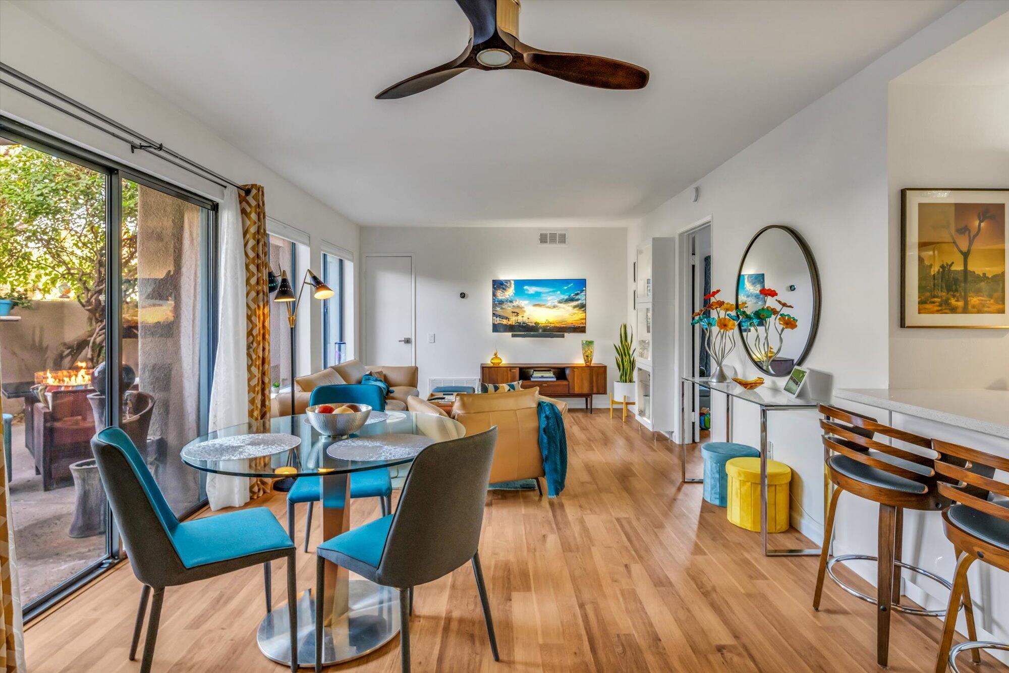 1100 East Amado Road, Unit 12B1 Palm Springs, CA 92262 - Photo 8 of 29 a living room with furniture and a wooden floor