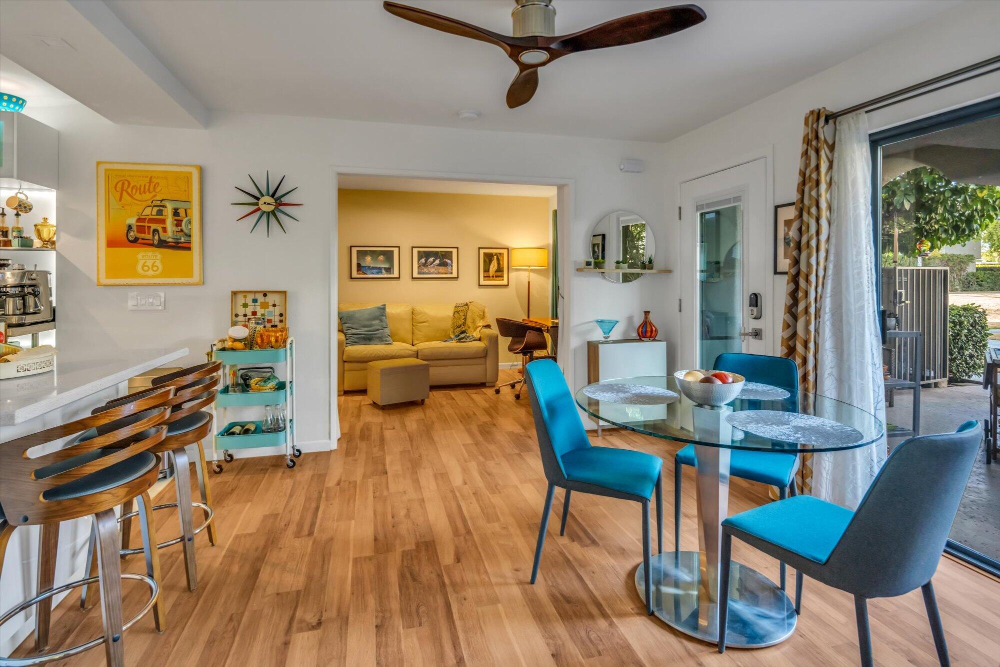 1100 East Amado Road, Unit 12B1 Palm Springs, CA 92262 - Photo 9 of 29 a living room with furniture and wooden floor
