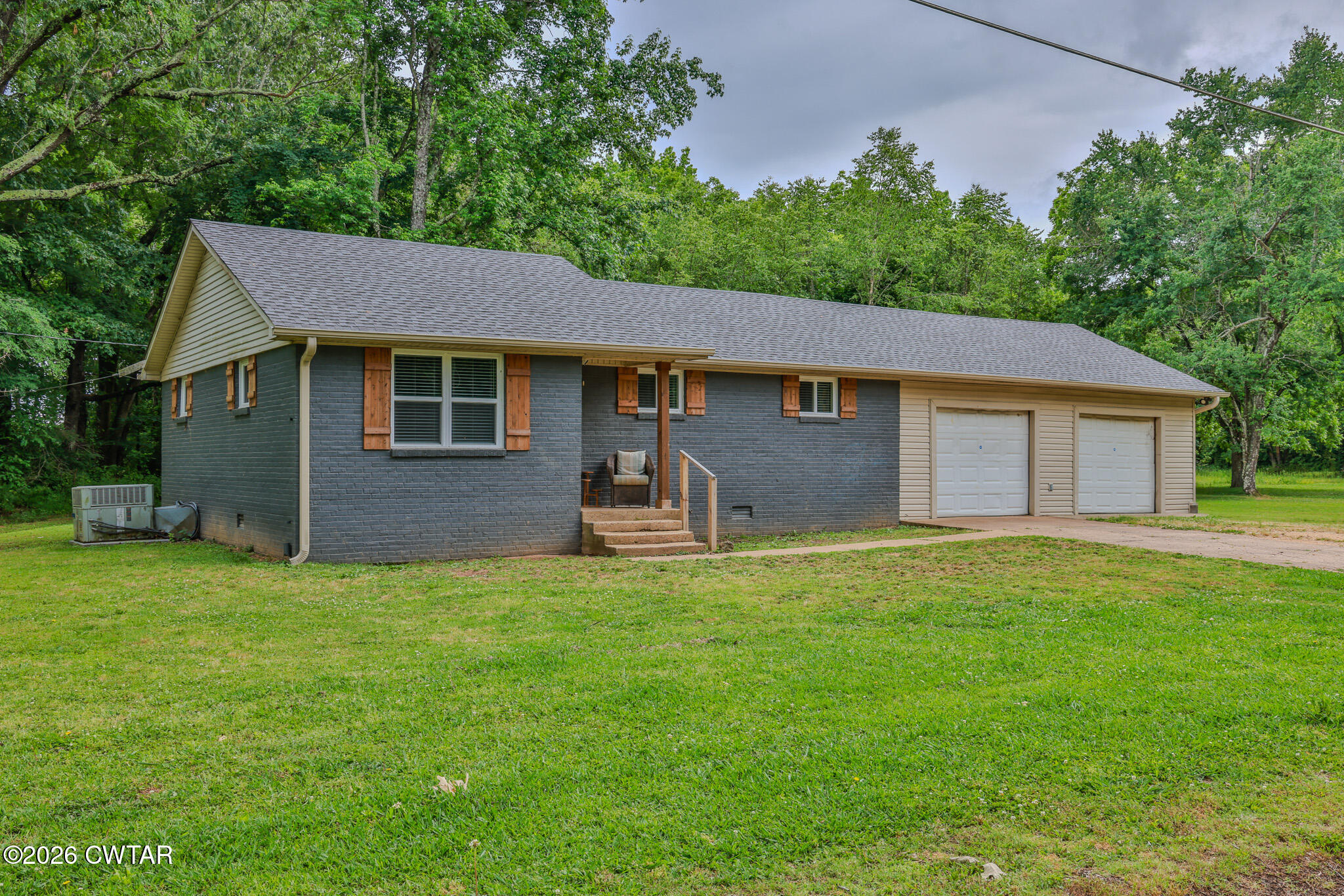 25 Shady Lane Huntingdon, TN 38344 - Photo 2 of 16 a backyard of a house with table and chairs