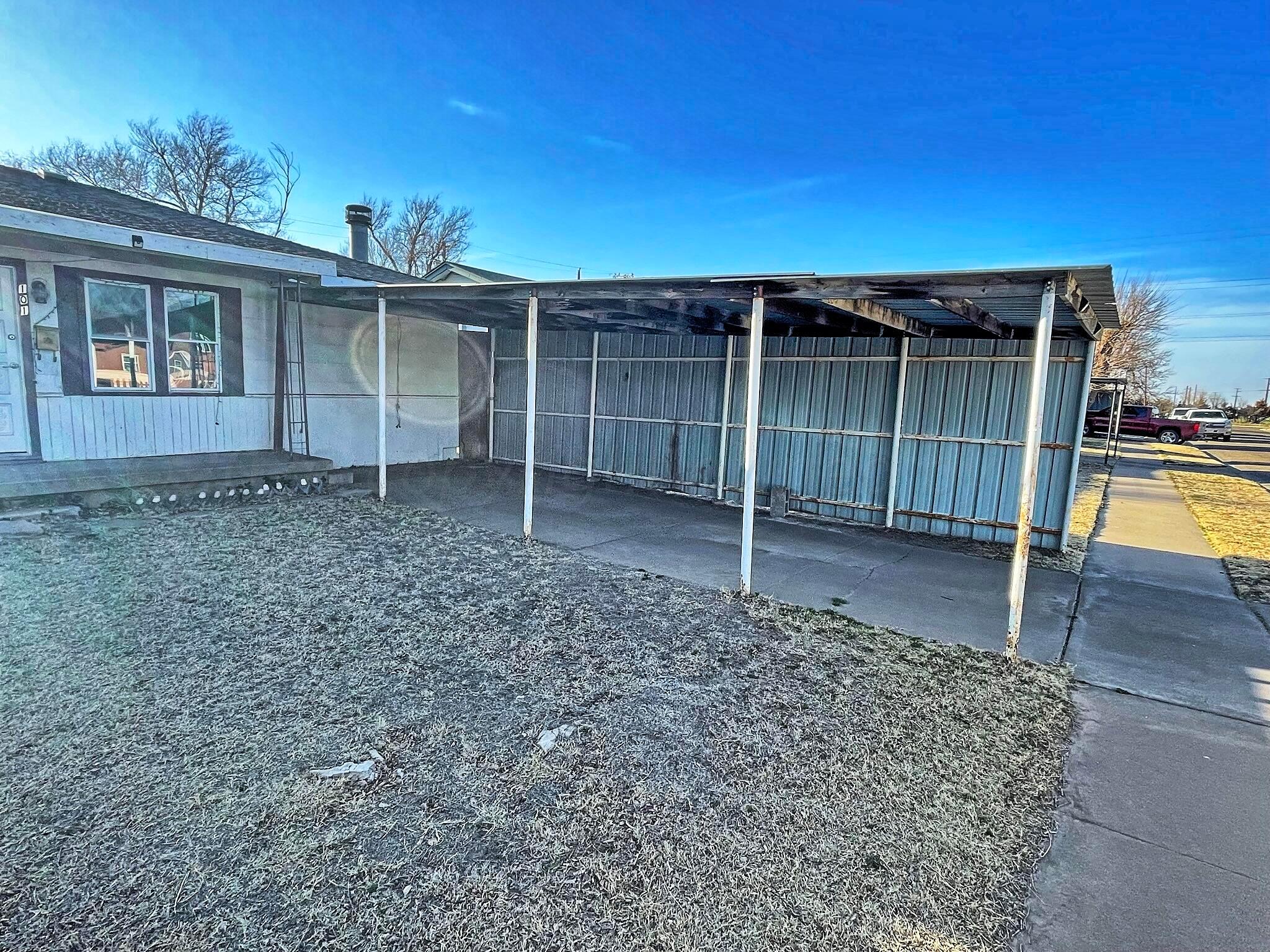 101 North Kentucky Street Perryton, TX 79070 - Photo 16 of 16 front view of a house with a yard