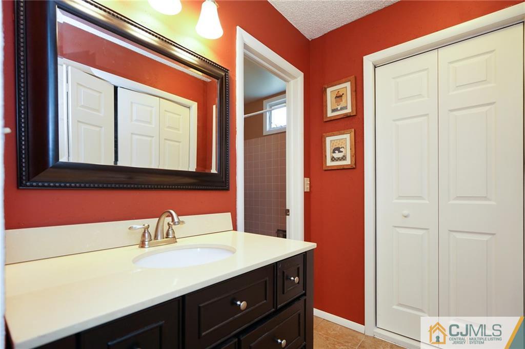 798 A Sparta Road Monroe Township, NJ 08831 - Photo 13 of 23 a bathroom with a sink and a mirror