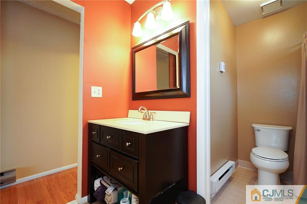 798 A Sparta Road Monroe Township, NJ 08831 - Photo 14 of 23 a bathroom with a toilet sink and mirror