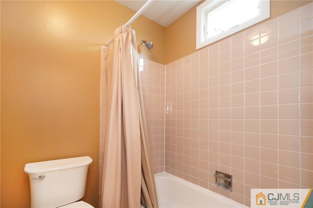 798 A Sparta Road Monroe Township, NJ 08831 - Photo 15 of 23 a bathroom with a shower a toilet and a sink