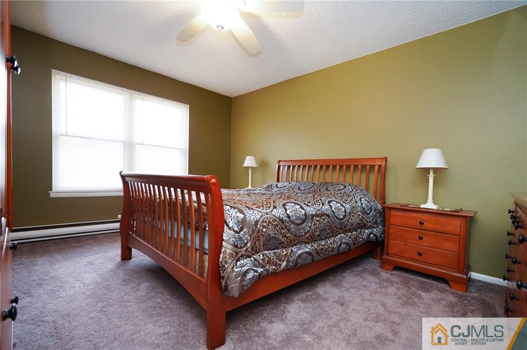 798 A Sparta Road Monroe Township, NJ 08831 - Photo 16 of 23 a bed sitting in a bedroom next to a window