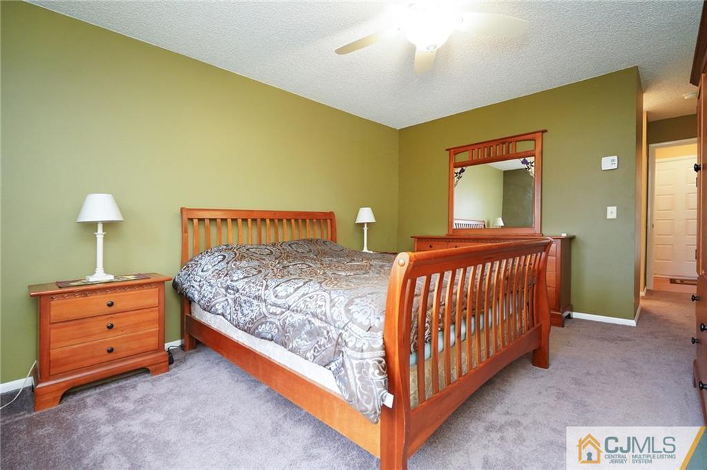 798 A Sparta Road Monroe Township, NJ 08831 - Photo 17 of 23 a bedroom with a bed and a dresser
