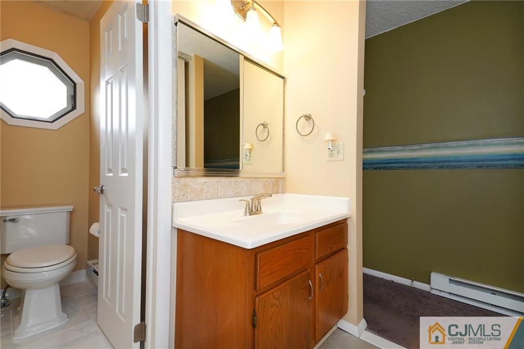 798 A Sparta Road Monroe Township, NJ 08831 - Photo 18 of 23 a bathroom with a sink and a mirror