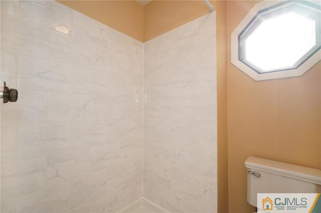 798 A Sparta Road Monroe Township, NJ 08831 - Photo 19 of 23 a bathroom with a toilet and a mirror