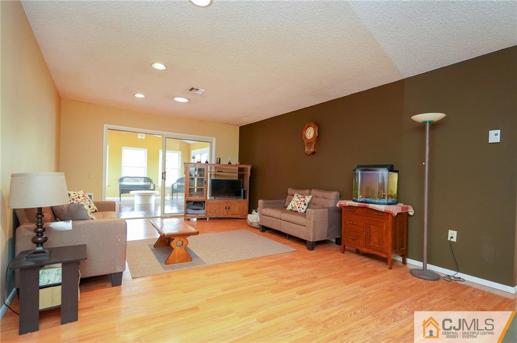 798 A Sparta Road Monroe Township, NJ 08831 - Photo 7 of 23 a living room with furniture and a flat screen tv