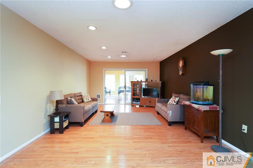 798 A Sparta Road Monroe Township, NJ 08831 - Photo 8 of 23 a living room with furniture and a wooden floor