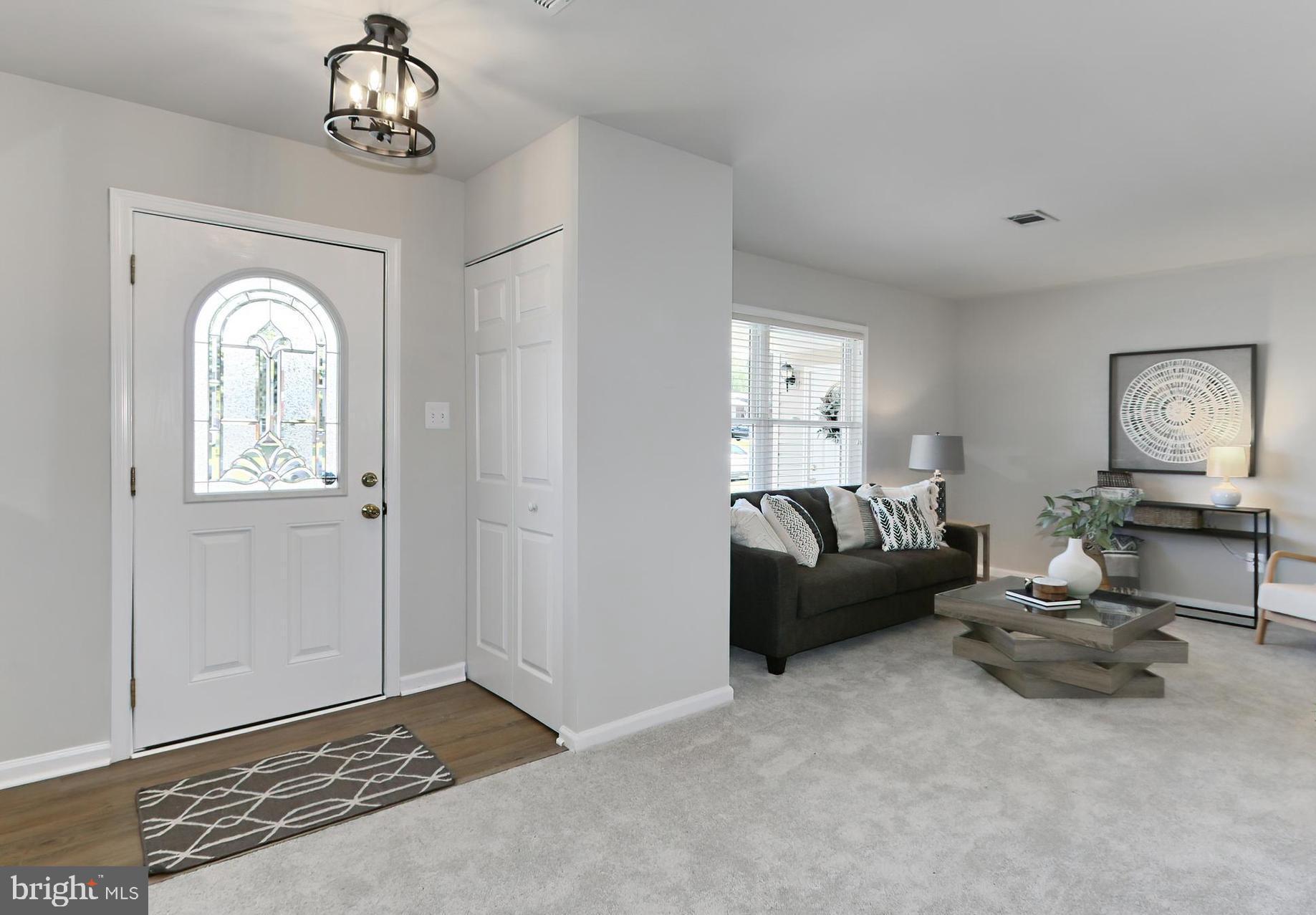 109 North Harrison Road Sterling, VA 20164 - Photo 4 of 32 New Foyer Light Fixture and Luxury Flooring