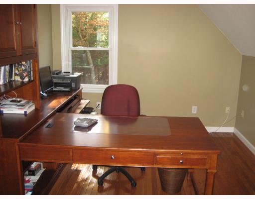84 Colonial Road Burrillville, RI 02830 - Photo 11 of 12 Bedroom. The third bedroom is currently being used as a study. Again, notice the hardwood flooring throughout. Here, you can also see the wooded views from all windows are very private.