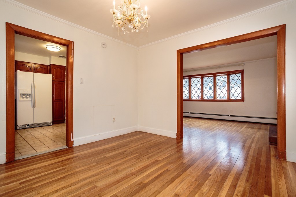 38 Taylor Road Belmont, MA 02478 - Photo 4 of 13 wooden floor in an empty room with a window