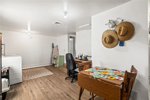 a view of workspace with furniture and wooden floor