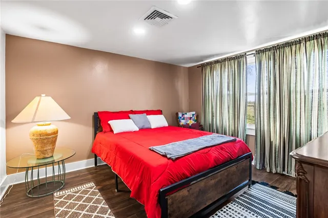 a bedroom with a bed and window