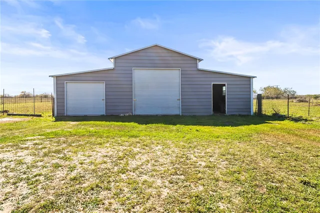 a house view with a backyard space
