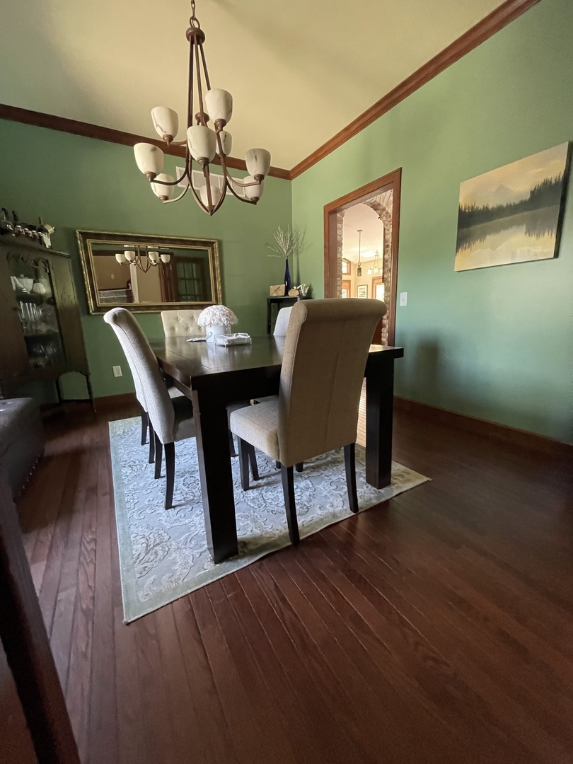 9482 Abbey Way Downs, IL 61736 - Photo 11 of 93 a view of a dining room with furniture and chandelier