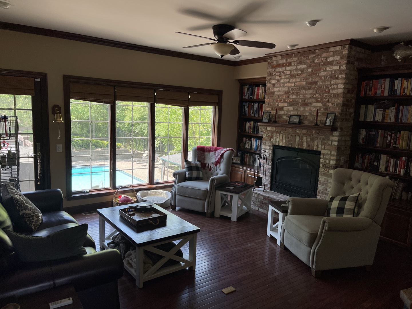 9482 Abbey Way Downs, IL 61736 - Photo 16 of 93 a living room with furniture a fireplace and a large window