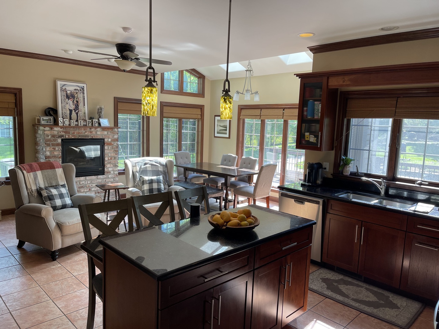 9482 Abbey Way Downs, IL 61736 - Photo 19 of 93 a view of a dining room and livingroom with furniture wooden floor a chandelier