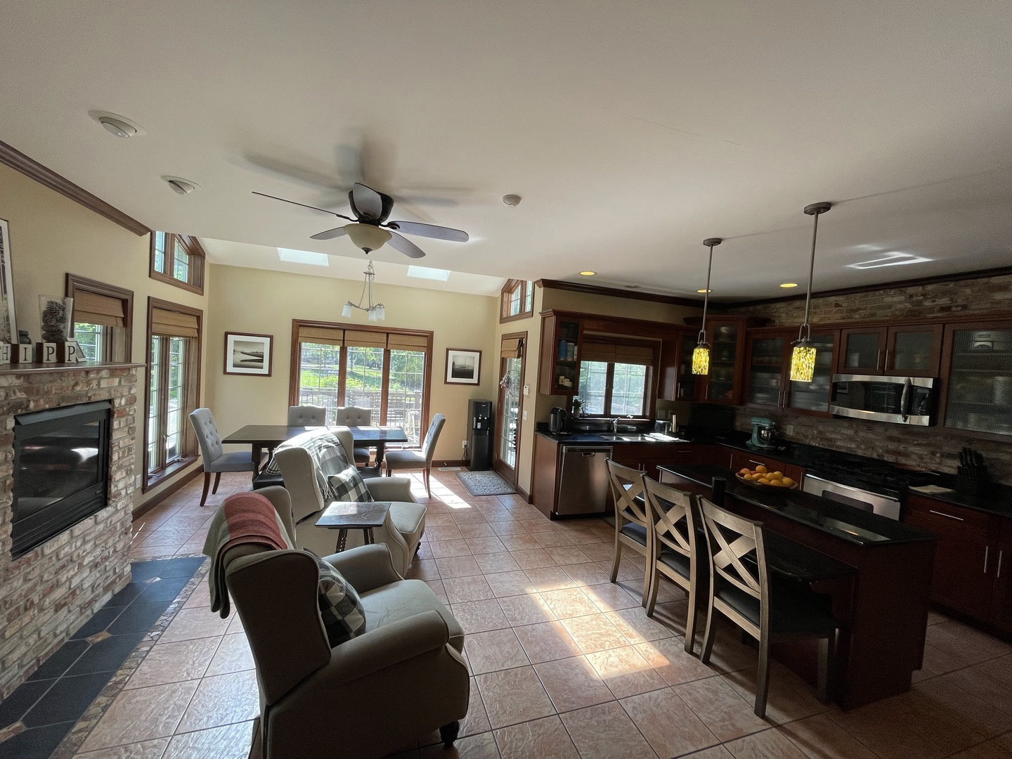 9482 Abbey Way Downs, IL 61736 - Photo 20 of 93 a living room with furniture a fireplace and a flat screen tv