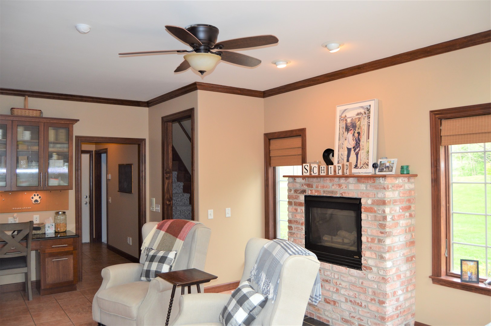 9482 Abbey Way Downs, IL 61736 - Photo 24 of 93 a living room with furniture and a fireplace