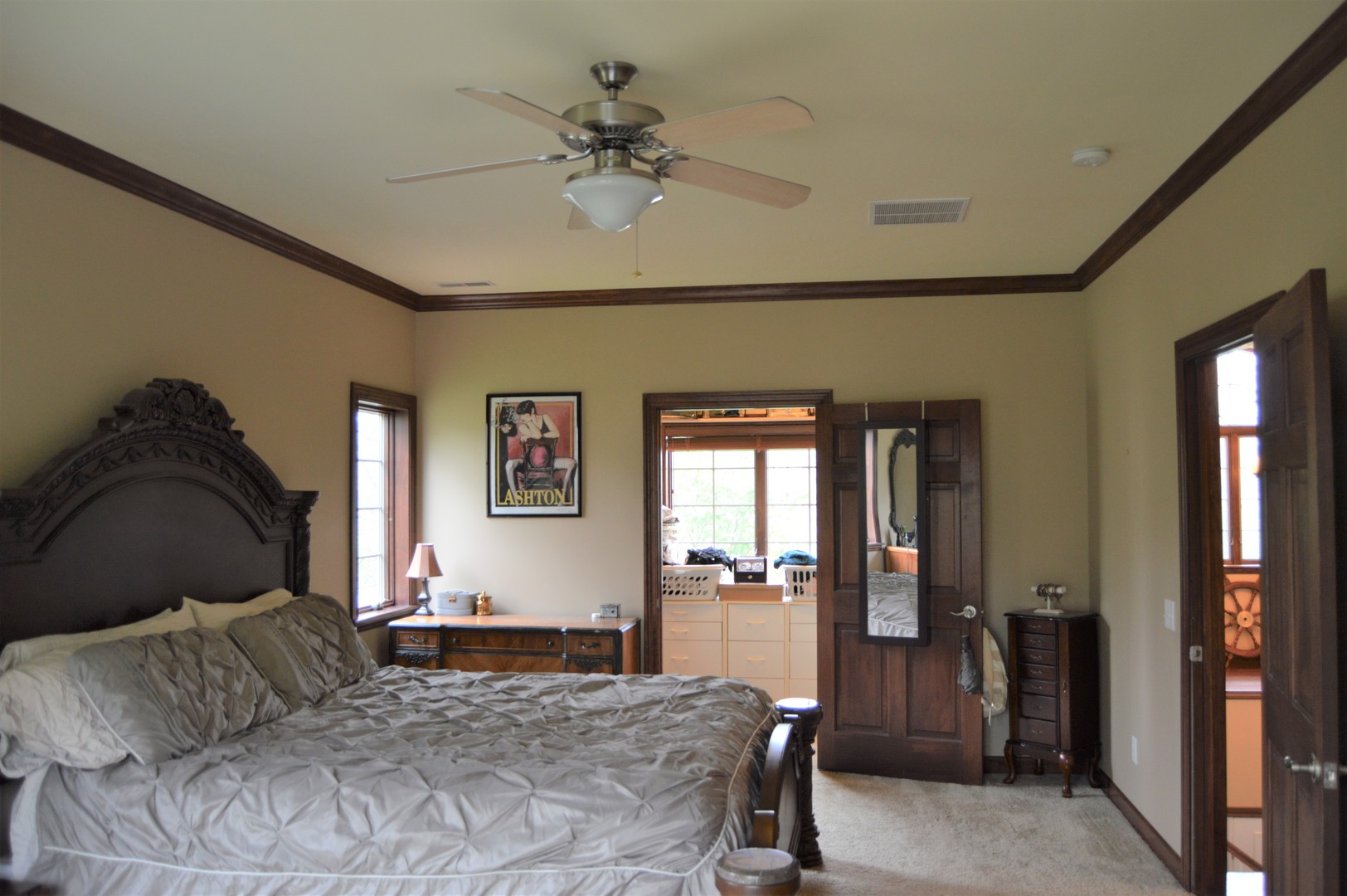 9482 Abbey Way Downs, IL 61736 - Photo 34 of 93 a bedroom with a bed and glass walk in closet