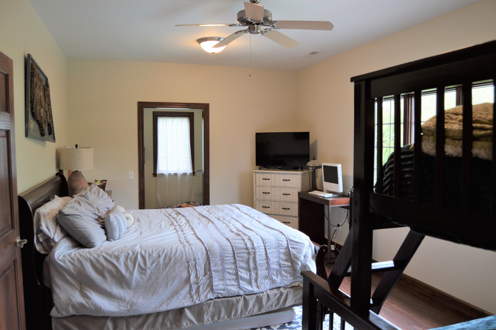 9482 Abbey Way Downs, IL 61736 - Photo 46 of 93 a bedroom with a bed and a flat screen tv