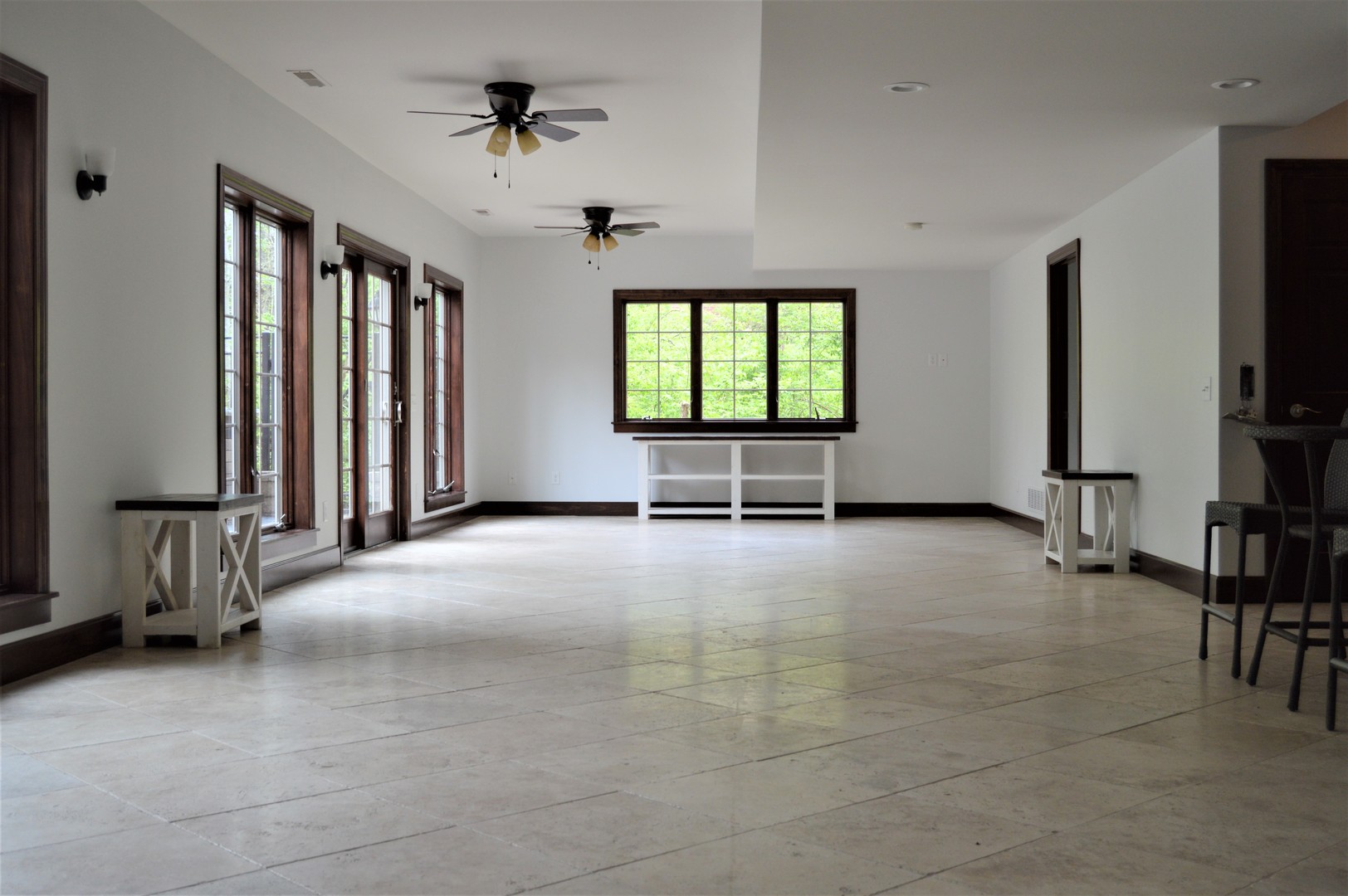 9482 Abbey Way Downs, IL 61736 - Photo 59 of 93 a view of an empty room with windows and a flat screen tv