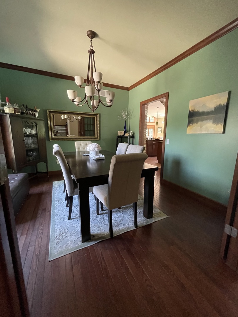 9482 Abbey Way Downs, IL 61736 - Photo 10 of 93 a view of a dining room with furniture and wooden floor