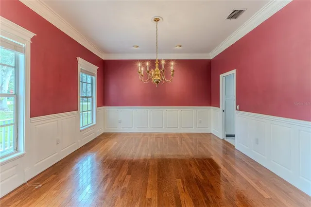 a view of room with a empty space and window