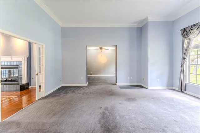 a kitchen with granite countertop a white cabinets and refrigerator
