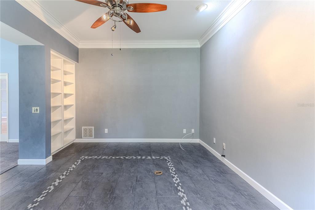 7512 Oak Tree Lane Spring Hill, FL 34607 - Photo 25 of 89 wooden floor in an empty room with a window